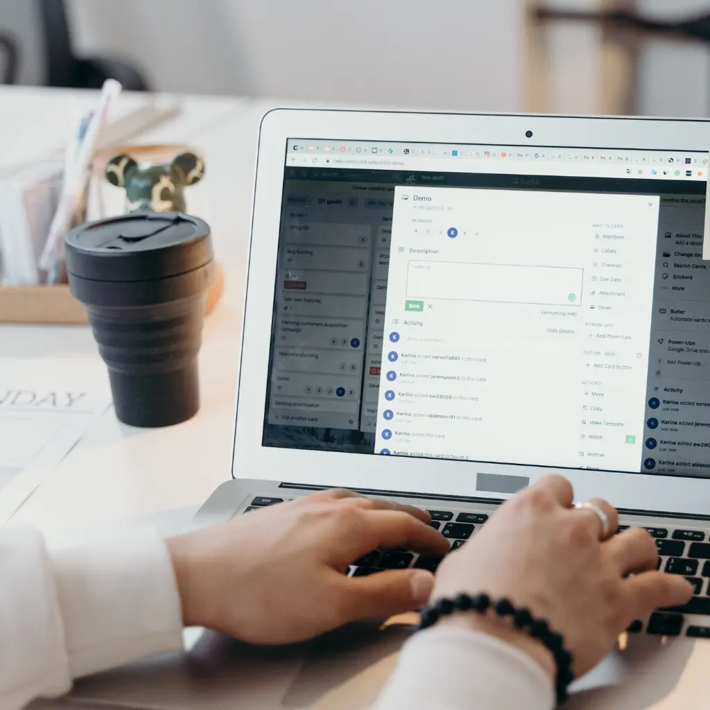 Fingers typing on a laptop